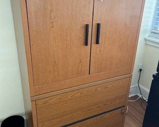 This unit is 2 pieces.  Locking storage cabinet on top of lateral file which also locks.  Nice quality!!