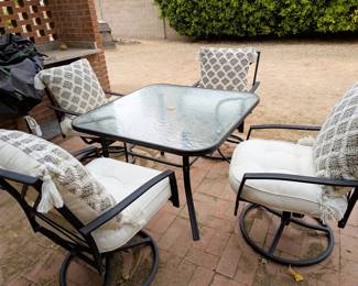Patio Set with Pier 1 Cushions. Excellent Condition with rocking swivel chairs.