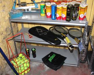 Good quality tennis racquets, cans of unopened tennis balls, tennis balls w/basket. Vintage tennis racquet stringer/stretcher.