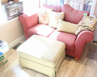 Upholstered love set and ottoman.