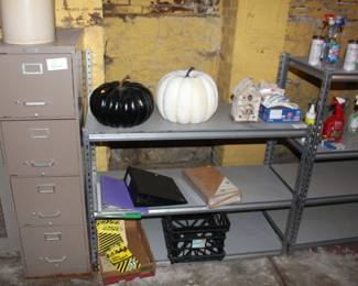 Four drawer file cabinet. Halloween pumpkins, metal shelves.