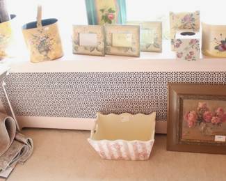 Lots of frames, rugs and decorative pieces.