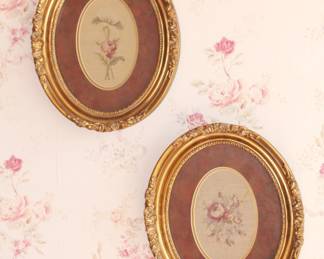 Oval framed needlepoint roses.