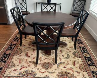 Basset cherry dining table with 6 chairs; 2 additional leaves; area rug not available.
