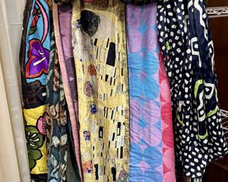 Lot 104: Collection of a dozen silk, designer & name brand women’s scarves and wraps