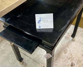 Lot 80: Lacquered Table on casters