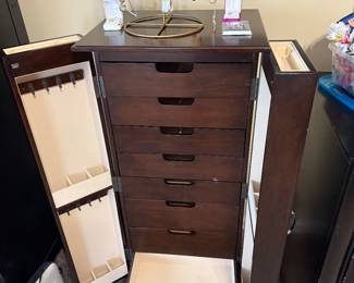 This jewelry cabinet has a liner that prevents jewelry from tarnishing.