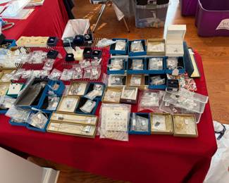 Table full of sterling jewelry