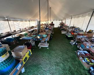 The 35 x 45 tent is FILLED with 20 8 ft. Banquet tables! STUFF to the gills on top and under the tables!