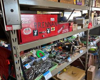 Dead center in the middle screen is a beautiful vintage four drawer snap on tool chest next to it in the red chest is a Milwaukee high impact drill