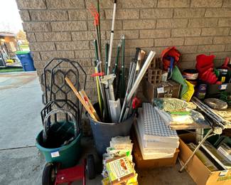 The bucket in the middle is filled with vices and all kinds of gardening equipment, measuring devices and more