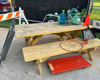 A very nice dirty, heavy picnic table, and more gardening supplies