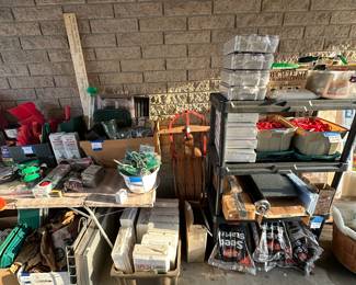 Here’s another 8 foot banquet table filled with gardening supplies