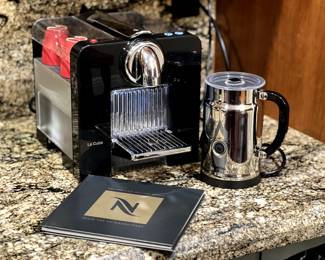 Nespresso Le Cube, Aeroccino, and Nespresso Recipe Book. Le Cube was discontinued and very hard to find. It holds four espresso cups (sold separately)