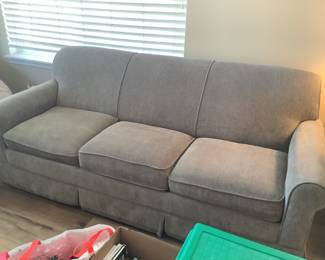 Almost new Grey sleeper sofa by Lazy boy.  Measures 74” w x 34” d x 32” h.  Presale $275.  Bed never used.