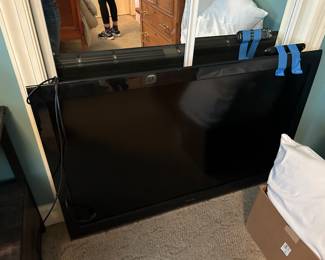 LARGE WALL MOUNT TV.