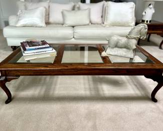 Beautiful coffee table, with table books and concrete horse sculpture.