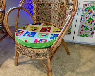 This is a vintage rattan armchair. One of two chairs.