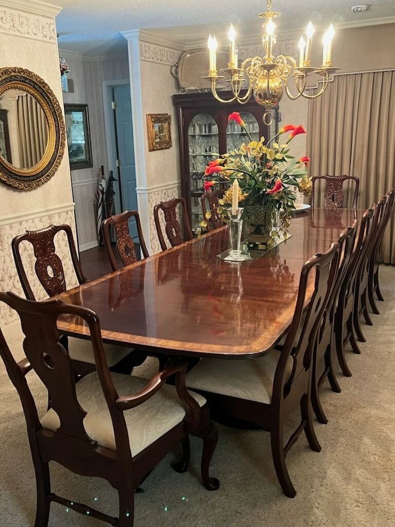 Custom-made 12 Place  formal dining room table with three leafs.