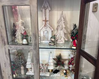 Christmas decor and other holidays as well in antique display case with lights 