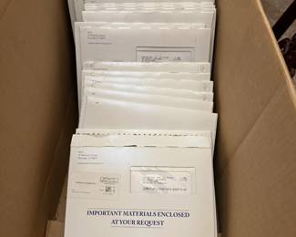More than 60 packets of USPS Mint commemorative stamp panels.