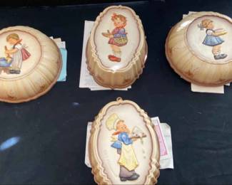 Four M.J. Hummel Kitchen Mould Series Wall Hanging
