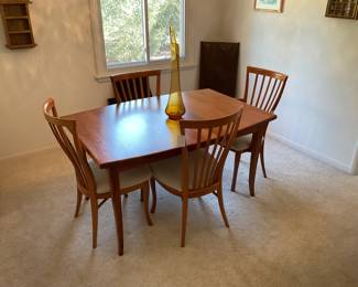 Contemporary table with leaf, table pads and extra legs. This table is in perfect condition.