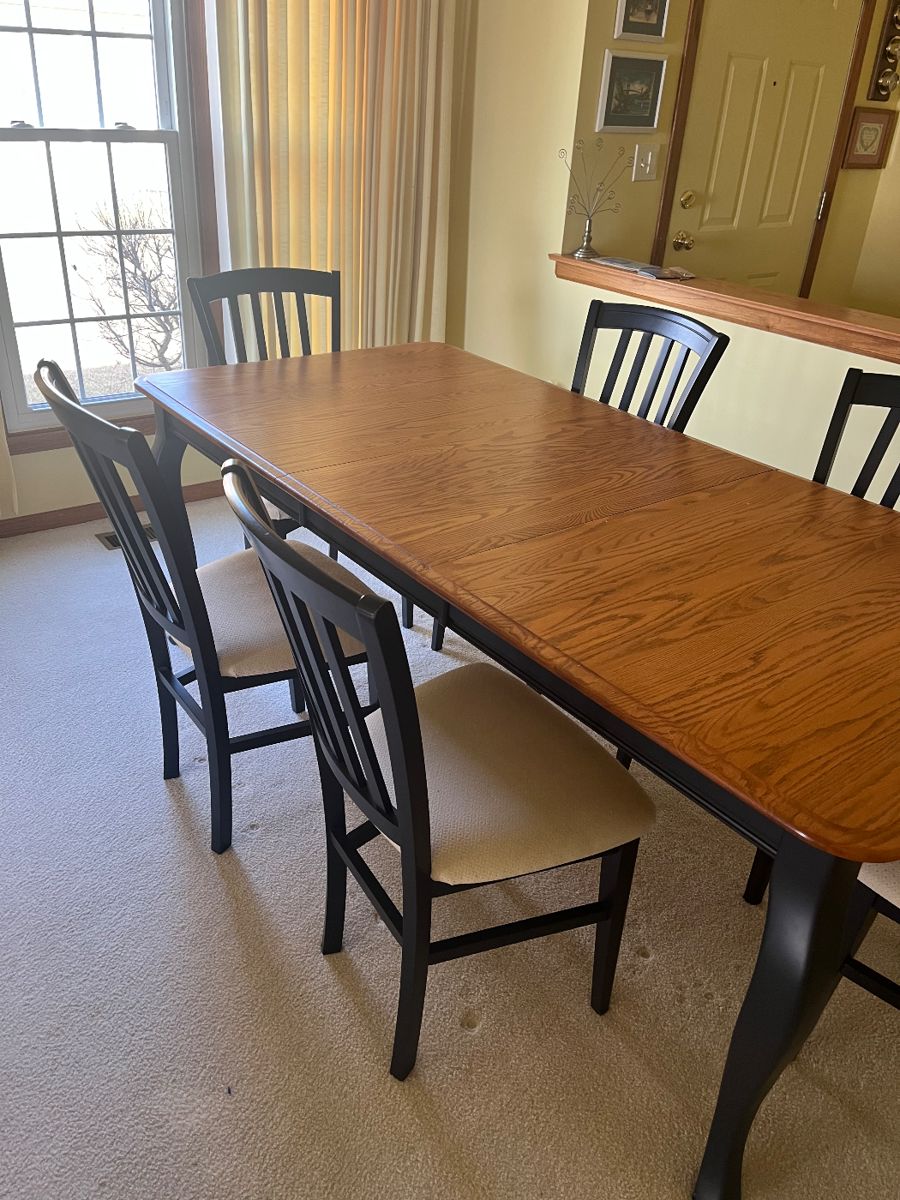 Navy blue table and  six chairs with natural wood table top.  Table shown with leaf.  Table top in perfect condition The chairs have a white cushion. $450.00