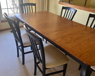 Navy blue table and  six chairs with natural wood table top.  Table shown with leaf.  Table top in perfect condition The chairs have a white cushion. $450.00