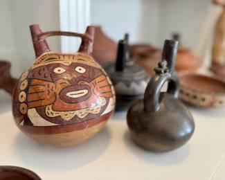 Nazca Stirrup-Spout Bottle with a Costumed Ritual Performer, similar examples dating from 200-600 AD. 