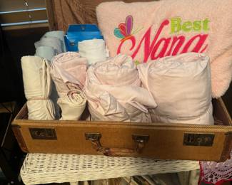 Sheets and vintage suitcases
