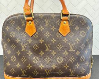 SOLD authentic Louis Vuitton handbag; 14x9. This is a used vintage piece and shows normal signs of wear. No significant damage. 