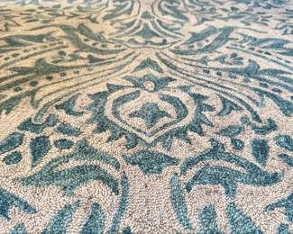 $200; looped rug with shades of grays, tans, blues; 5'x8'