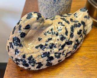 Pottery by man spotted duck