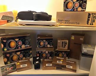 Nikkor 75-300mm, Nikkor 85-200mm, Nikkor 35-70mm, Nikkor 24-50mm, Nikkor HB-11, Nikkor 77mm filter, 