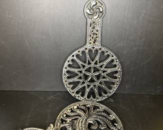 Vtg. Black cast iron trivets. Large collection