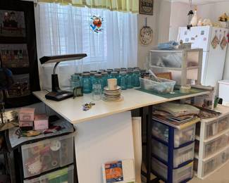 Ball jars and crafting desk/table with supplies