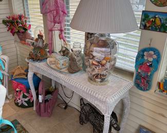 Wicker table, seashells and flamingos 