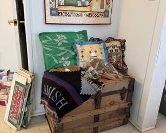 Trunk with quilted throws, pillows