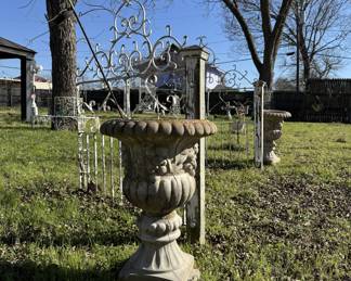 Concrete urns and iron gates