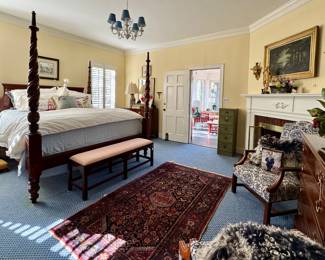 King Bed, dreamy rugs, great art and this room is packed with designer clothing