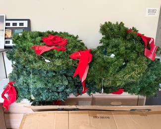 Around two dozen large and medium Christmas wreaths