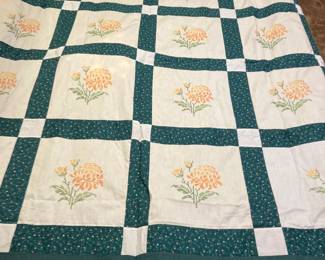 Quilt top w cross-stitched flowers
