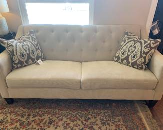 Cream tufted back sofa