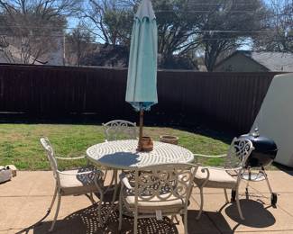 Patio set with cushions and umbrella, Weber grill