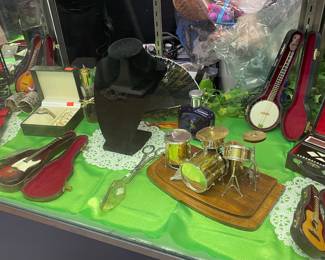 Miniature instruments displayed in our jewelry cabinet looking great.