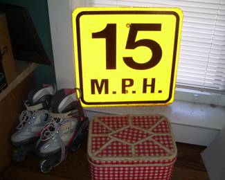 Road Sign, Rollerblades and Vintage Metal Picknick Box