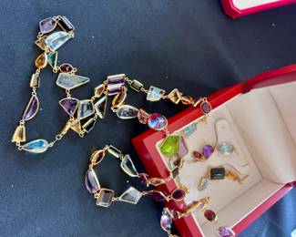 Please ask for paperwork on this...GIA CERTS....Multi Stone MCM  18kt long necklace, bracelet and earrings set..valued at over 9k