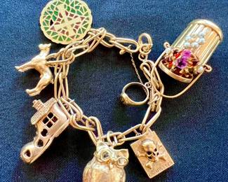 80.2 grams of crazy cool 14kt charms!