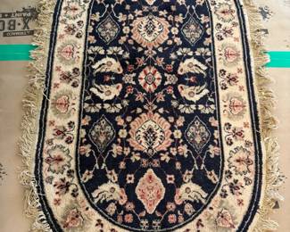 Oval Oriental Area Rug with Navy & Fringed